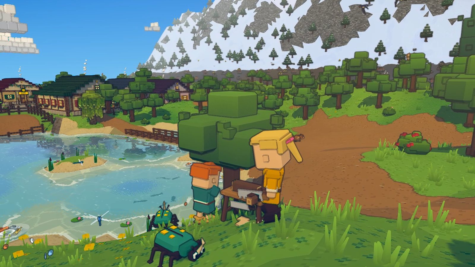 One player chops an oak by a pond while a friend saws logs into planks at a sawbench beside it, the town and the snowy peaks behind.
